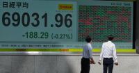 Asian shares slip as worries about rising oil prices offset boost from strong earnings