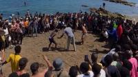 Bare-chested migrants hold wrestling match on Ceuta beach weeks after mass border crossing