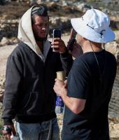 Exclusive-Israeli settler confronts Palestinian American at his besieged West Bank home