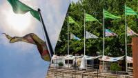 Flags fly through the air at Spruce Street Harbor Park to share stories about immigration