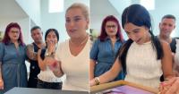 The reaction of this young Cuban woman and her family upon seeing the photos from her quinceañera in the U.S.
