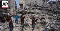 Gaza workers salvage iron bars from destroyed buildings for shelters, furniture