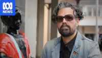 Feud escalates as artist puts warning on 'racist' statue