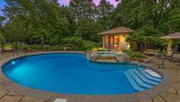 See inside rare, Arizona-style home with pool house, saloon, screened porches