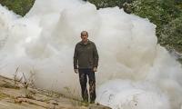 Massive 'foamberg' kills hundreds of fish as water used to extinguish industrial blaze pollutes nearby river