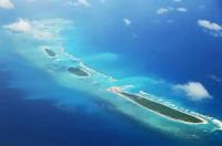 China completes first stage at disputed reef