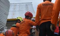 Elderly woman found alive under rubble days after Indonesia quake
