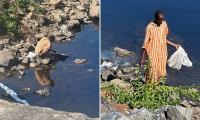 Outrage after man is filmed doing LAUNDRY in scenic Maine river and filling its waters with detergent that's toxic to nature