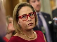 Ex-U.S. senator Kyrsten Sinema recalls when bodyguard's wife called out their affair
