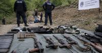 Kosovo police find weapons near suspected mass graves