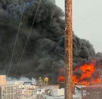 Construction timeline for new housing uncertain after building materials burn in Naujaat