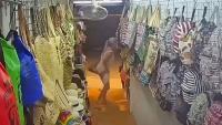 Nasty out-of-control woman caught relieving herself on clothes shop's CCTV on holiday