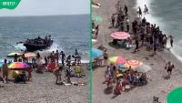 “This is so unacceptable”: Social media stunned as migrant boat lands on packed Spain beach