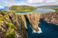 This Faroe Islands lake appears to float above the Atlantic—nature’s infinity pool