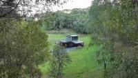 Australian builder rescues 40 burn-pile logs, turns them into a cabin built to move