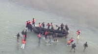 Spanish region demands answers after migrants land on crowded beach (VIDEOS)