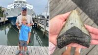 Vacationing father and son pull massive megalodon tooth from New Jersey shore