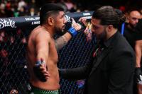 Crowd throws objects at ex-UFC fighter for landing several punches after referee waved bout off
