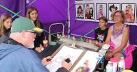 Connecting through caricatures: Artist capturing 'energy' at Dodge County Fair