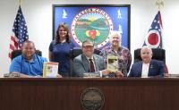 Commissioners’ topics: Sam Brady salute, solar/wind energy, Editor Ed Clark
