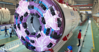 China's colossal tunneling machine bores AND blasts through raw ground