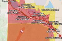 Fast-growing wildfire threatens thousands of homes in Nevada
