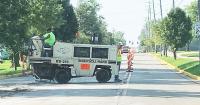 Pedestrian crossing downtown among city construction plans