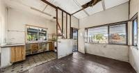 'Unliveable' house sells at auction after bidders swarm on bargain listing