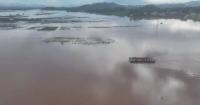 Powered pontoon bridge used to transfer locals, supplies in flooded village