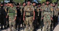 Kurdish-led forces in Syria dissolve after merging with army