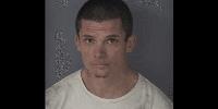Florida crook accused of ditching stolen car, hiding from cops in home's garage. But homeowner has a gun.