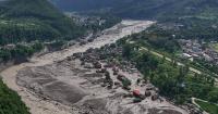 Dozens of Australians missing in deadly flash floods