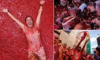Paint the town red! Thousands take over Spanish village for the La Tomatina food fight
