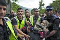 157 killed and more than 400 missing in flood fury
