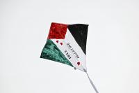 Gaza boy tears apart kites after Israel threatens attacks