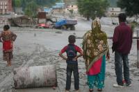 Devastation in Nepal and China after flash flood, Tanzania’s political infighting tests its political stability, French presidential candidates face off in first debate