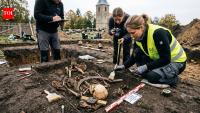 Archaeologists are investigating a 400-year-old Polish grave where a young woman was buried in a way meant to prevent her return