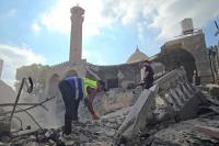 Palestinians work to save artifacts from historic Gaza mosque after Israeli attack