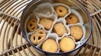 DIY A Clever Countertop Storage Solution Out Of Thrifted Cookie Tins