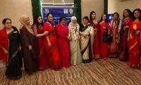 Sharing hearts: Inner Wheel Agradut members stand beside Dhaka's underprivileged women