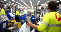 Parcels, real estate sales send AusPost profit higher