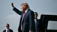 Trump's 'hair piece' loses fight with wind on tarmac as he heads to Texas