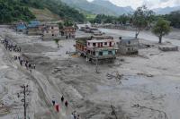 China says barrier lake on Nepal-Tibet border has already started to overflow and could cause second flash flood