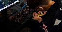 A Taiwanese gamer from the esports team Flash Wolves takes pills during a training session for the 'League of Legends' World Championship at a boot camp in Shanghai.