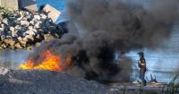 Flames engulf beach as riot police deployed in Spanish clashes with African migrants