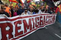 Spanish govt urges calm after anti-migrant protesters clash with police