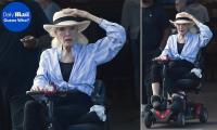 Iconic TV siren, 93, who played a 'feline devil' looks unrecognizable decades after captivating fans in a leather catsuit... can you guess who?