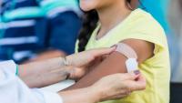 Doctors already have some flu vaccines as COVID shots lag behind