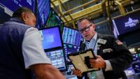 Stocks fall while dollar, bond yields rise as Warsh prompts rate hike bets