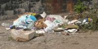 Old West End neighbor cleans up dumped trash left behind by construction crew